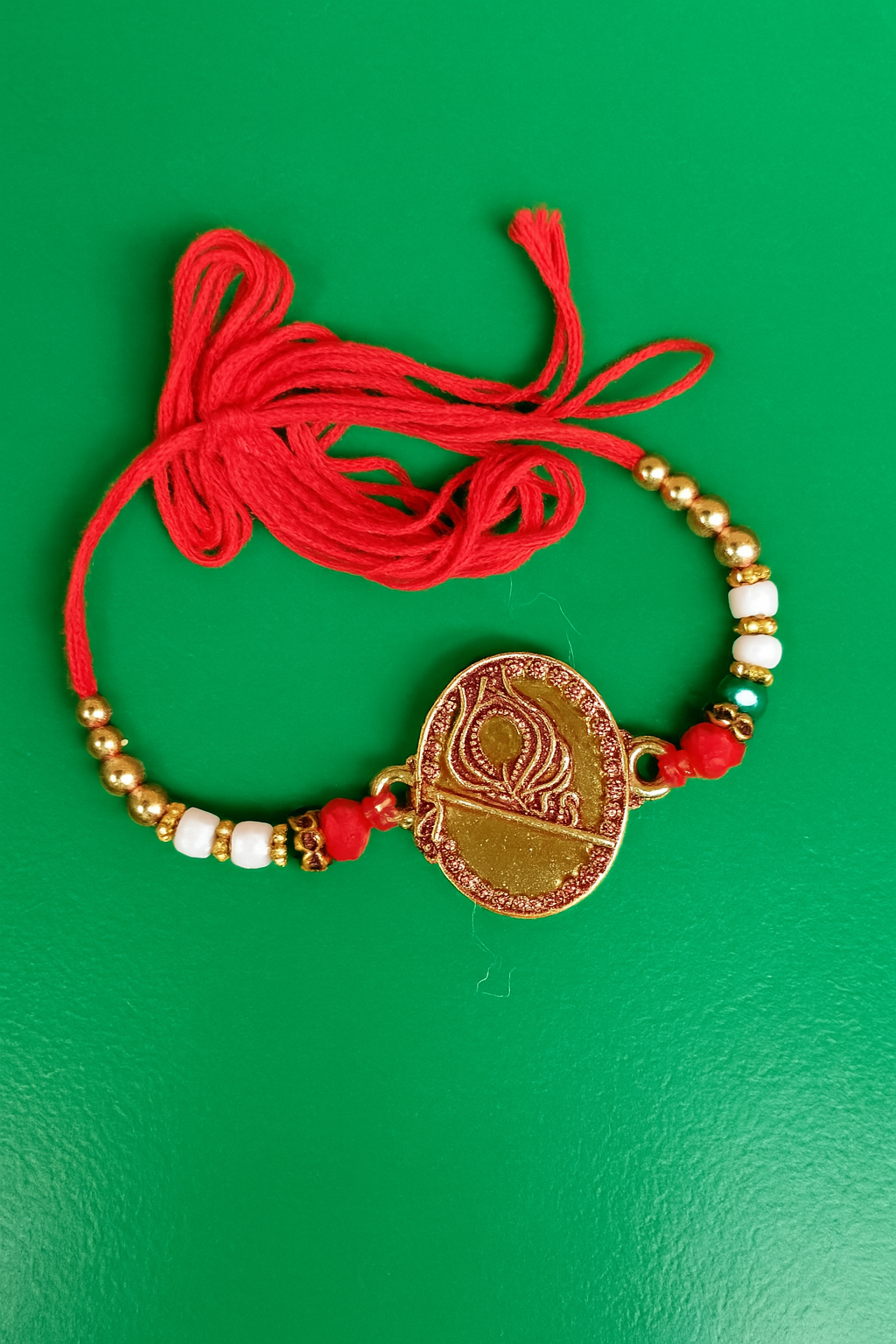 Elegant Traditional Rakhi with Golden Diya Design