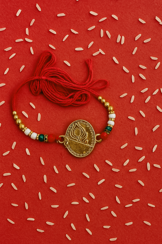 Elegant Traditional Rakhi with Golden Diya Design